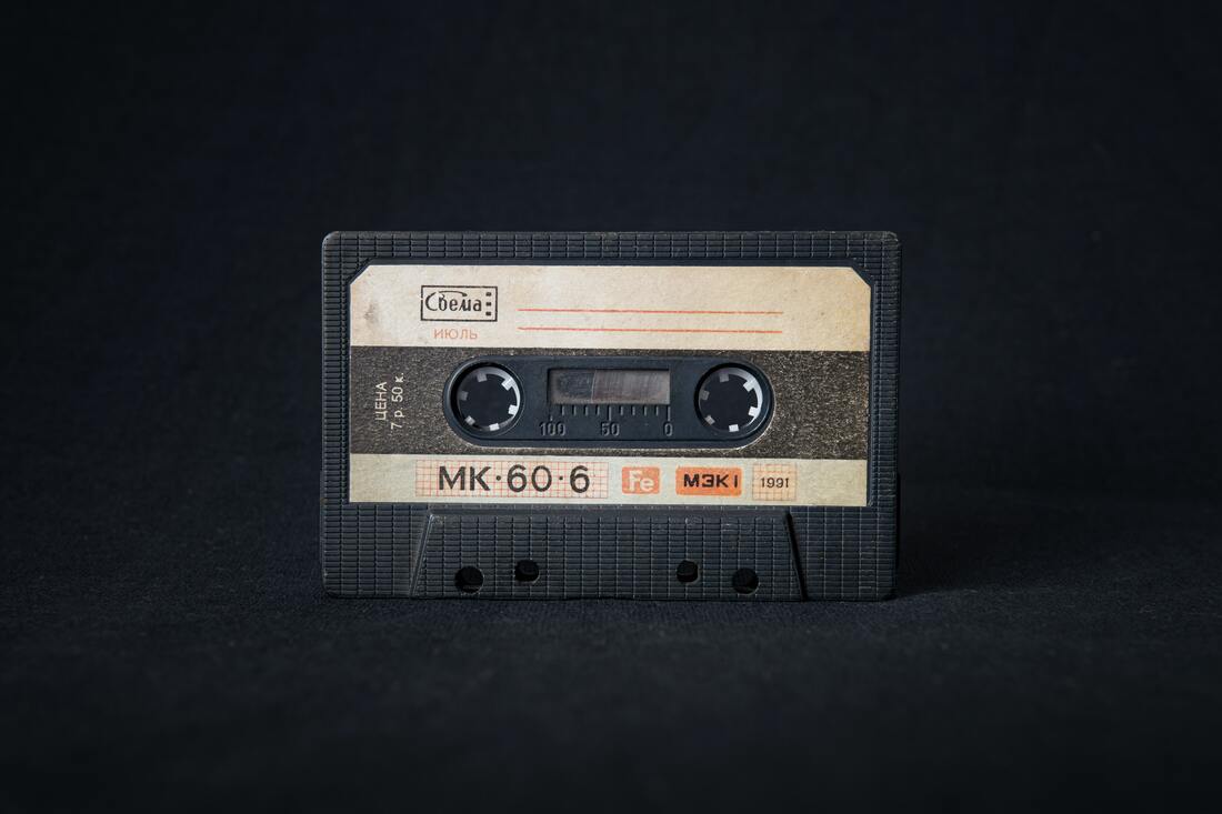 Vintage cassette tape with worn out edges, perfect for retro music lovers.